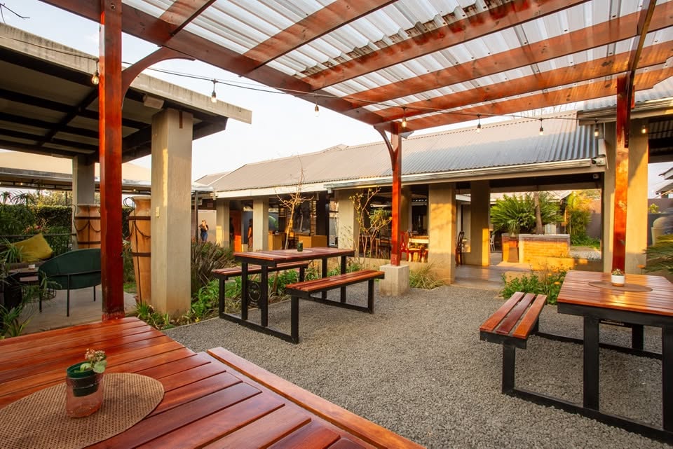 Relaxed outdoor courtyard and dining area at Café Crust